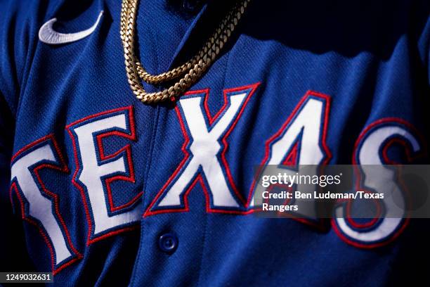 Detailed view of a chain on top of a jersey during a spring training game between the Texas Rangers and the the San Francisco Giants at Surprise...