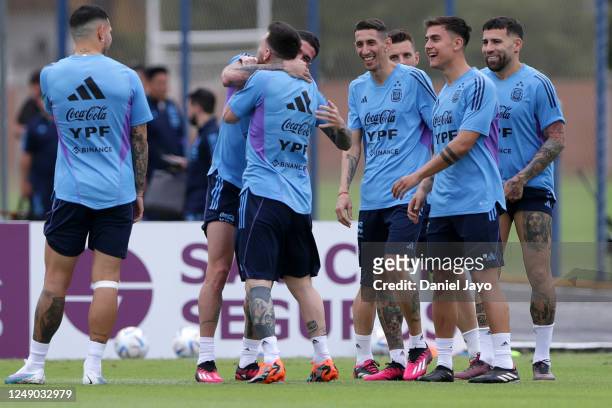 Rodrigo De Paul, Lionel Messi, Angel Di Maria, Paulo Dybala and Nicolas Otamendi of Argentina joke during a training session at Julio H. Grondona...