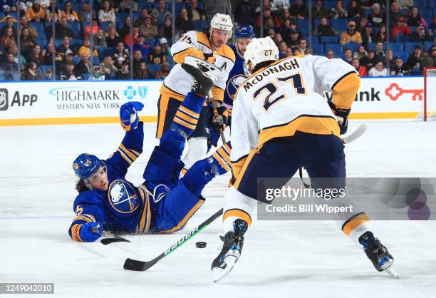 Owen Power of the Buffalo Sabres falls to the ice during an NHL game against the Nashville Predators on March 21, 2023 at KeyBank Center in Buffalo,...