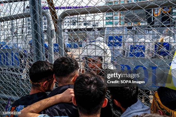 Teenagers seen arguing with the police during the clashes. Locals clashed with police during Newroz celebrations in Diyarbakir, the Kurdish people's...