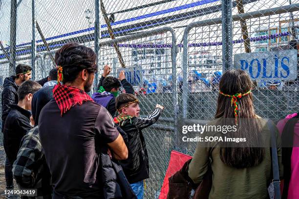 Teenagers seen arguing with the police during the clashes. Locals clashed with police during Newroz celebrations in Diyarbakir, the Kurdish people's...