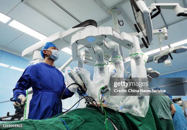 Surgeons operate a da Vinci Surgical robot during a surgical operation at Qinghai Provincial People's Hospital on June 11, 2020 in Xining, Qinghai...