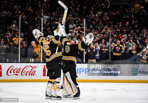 Linus Ullmark and Jeremy Swayman of the Boston Bruins celebrate after a win against the Ottawa Senators at TD Garden on March 21, 2023 in Boston,...