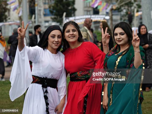 Group of Kurdish women make victory signs during the Nawroz celebration in Diyarbakir. A traditional Kurdish celebration marking the arrival of...