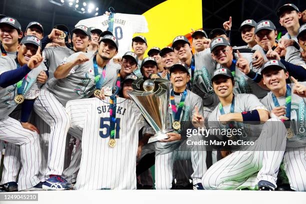 Members of Team Japan celebrate on the field after Team Japan defeated Team USA in the 2023 World Baseball Classic Championship game at loanDepot...