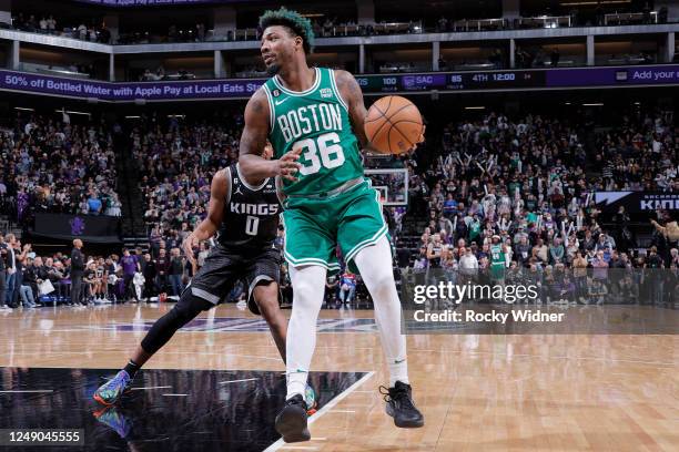 Marcus Smart of the Boston Celtics handles the ball during the game against the Sacramento Kings on March 21, 2023 at Golden 1 Center in Sacramento,...