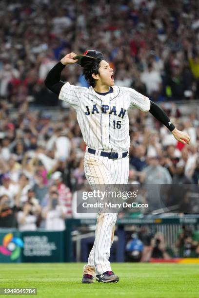 Shohei Ohtani of Team Japan celebrates on the field after Team Japan defeated Team USA in the 2023 World Baseball Classic Championship game at...