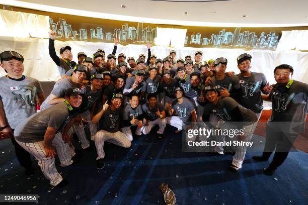 Team Japan poses for a team photo as they celebrate in the locker room after defeating Team USA, 3-2, in the 2023 World Baseball Classic Championship...