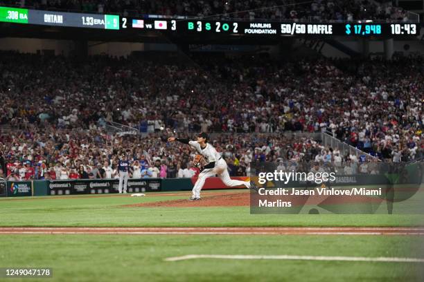 Shohei Ohtani of Japan bats in the first inning delivers a pitch in the ninth inning to strike out Mike Trouth of the United Sates and defeat the...