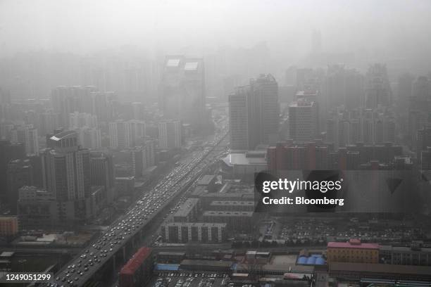 Buildings shrouded in smog during a sandstorm in Beijing, China, on Wednesday, March 22, 2023. Beijing warned vulnerable residents to stay indoors...