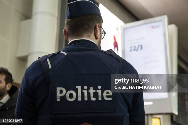 Police officer pictured during a ceremony at Brussels Airport in Zaventem to commemorate the 2016 terrorist attacks in Brussels, Wednesday 22 March...