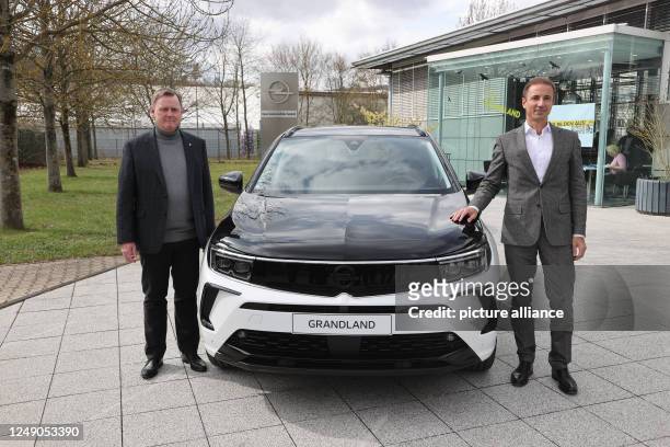 March 2023, Thuringia, Eisenach: Bodo Ramelow , Prime Minister of Thuringia, and Florian Huettl, Managing Director of Opel Automobile GmbH, stand by...