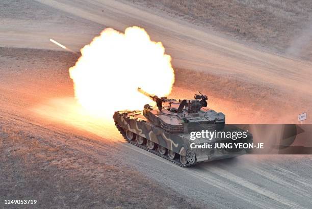 South Korean K1A1 tank fires during a Warrior Shield live fire exercise at a military training field in Pocheon on March 22 as part of the Freedom...