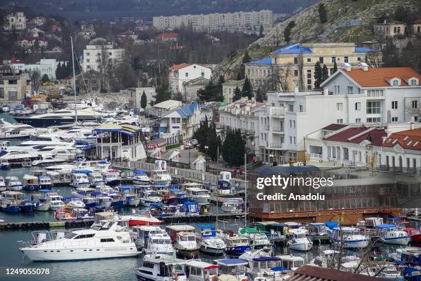 View of yacht marina at the city of Balaklava in Sevastopol, Crimea on March 20, 2023. The Genoese fortress, which has history dates back to very...