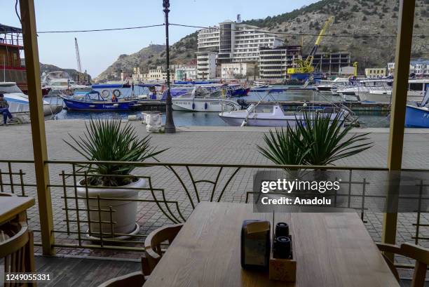 View of yacht marina at the city of Balaklava in Sevastopol, Crimea on March 20, 2023. The Genoese fortress, which has history dates back to very...