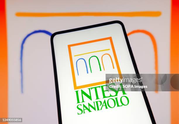 In this photo illustration, the Intesa Sanpaolo logo is seen displayed on a smartphone.