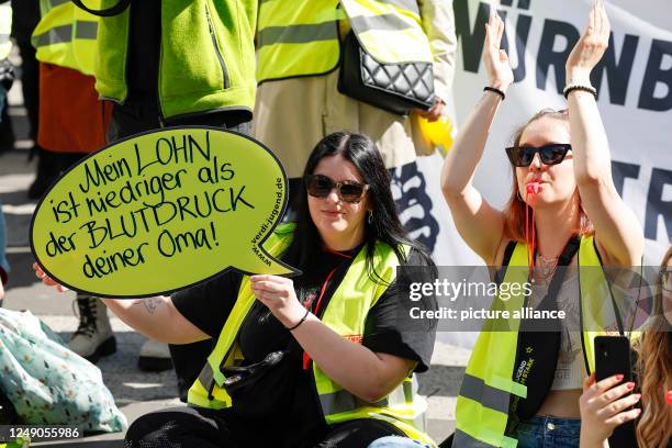 March 2023, Bavaria, Nuremberg: During the warning strike of public service employees, numerous people take part in a rally at Kornmarkt, here...