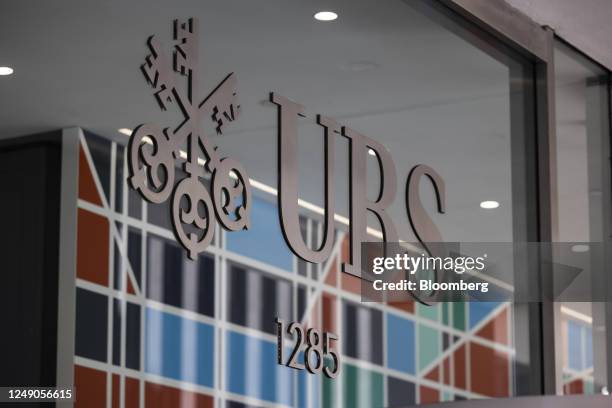 Signage at the UBS flagship office in New York, US, on Tuesday, March 21, 2023. UBS Group AG jumped as much as 10%, on track for its biggest gain...