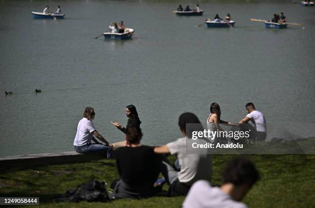 People enjoy the weather at the Retiro Park as Spanish capital Madrid sees warm temperatures on March 22, 2023.