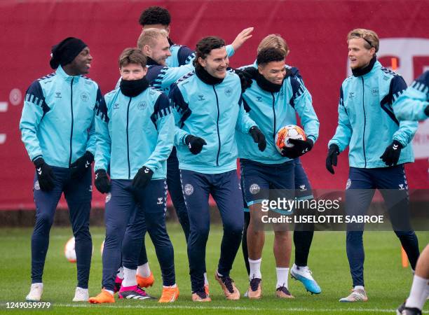Denmark's team attends a training session in Helsingoer, Denmark, on March 22 on the eve of the UEFA Euro 2024 qualification match against Finland. /...