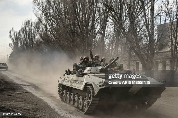 Ukrainian servicemen head toward Bakhmut in a BMP infantry fighting vehicle, in eastern Ukraine on March 22, 2023.