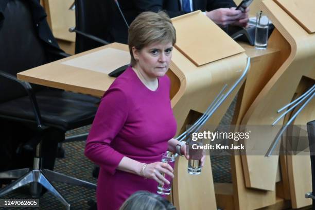 First Minister Nicola Sturgeon enters the debating chamber to make a statement in the Scottish Parliament on Historical Adoption Practices, in which...