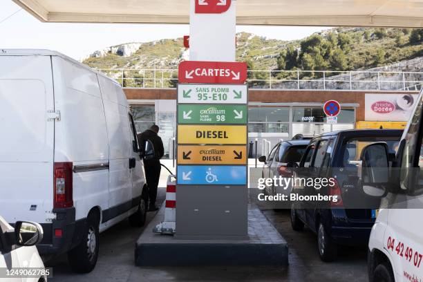 Motorists refuel after waiting in long lines at a TotalEnergies SE gas station on the outskirts of Marseille, France, Wednesday, March 22, 2023....