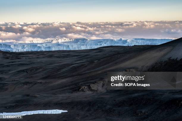 Small portion of the glacier left on top of Kilimanjaro. The melting glacier on top of Mount Kilimanjaro. Several studies have shown the glacier has...