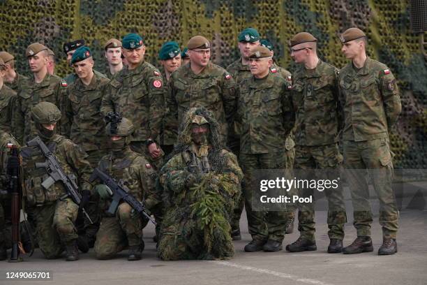 Members of the Polish military pose for a photo during a visit by Prince William, The Prince of Wales to the 3rd Brigade Territorial Defence Force...