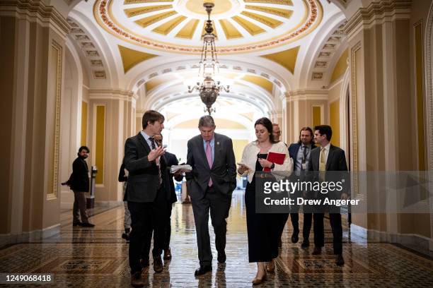 Sen. Joe Manchin speaks with reporters on his way to a closed-door lunch meeting with Senate Democrats at the U.S. Capitol March 22, 2023 in...