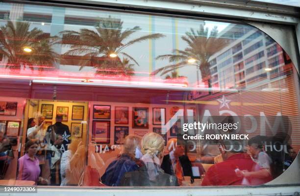 Republican presidential candidate Arizona Senator John McCain and his wife Cindy meet with local business owners and Florida Governor Charlie Crist...