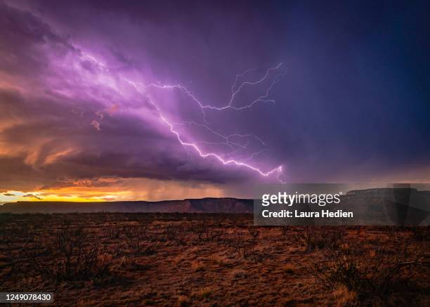 lightning over the mesa - lightning purple stock pictures, royalty-free photos & images