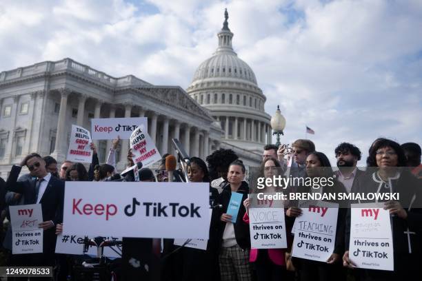 People gather for a press conference about their opposition to a TikTok ban on Capitol Hill in Washington, DC on March 22, 2023. - The White House...