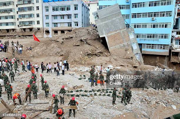 Rescuers set up to search for survivors after a deadly flood-triggered landslide hit Zhouqu, causing flooding in northwest China's Gansu province on...