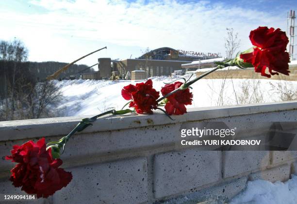 Flowers lies on the wall outside the water park, whose roof colapsed in Moscow, 15 February 2004. At least 24 people were killed and 110 others...