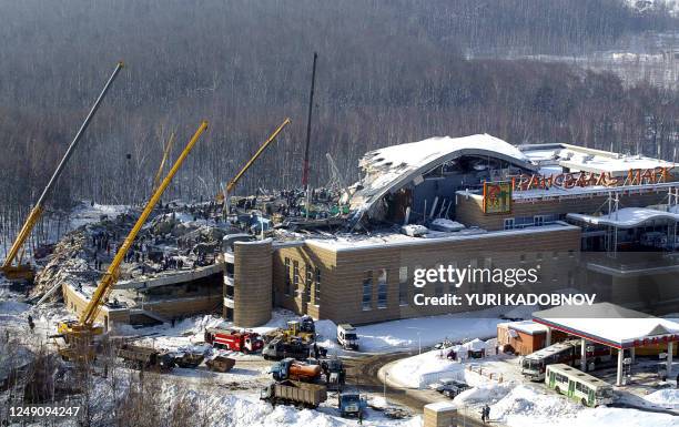 Rescuers demolish the site of the collapsed indoor pool in Moscow, 15 February 2004. At least 26 people were killed and 110 others injured when a...