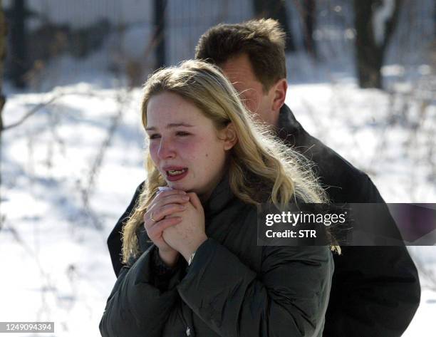 Girl, relative of one of the victims of the water park, whose roof collapsed, cries outside the city morgue in Moscow, 15 February 2004. At least 24...