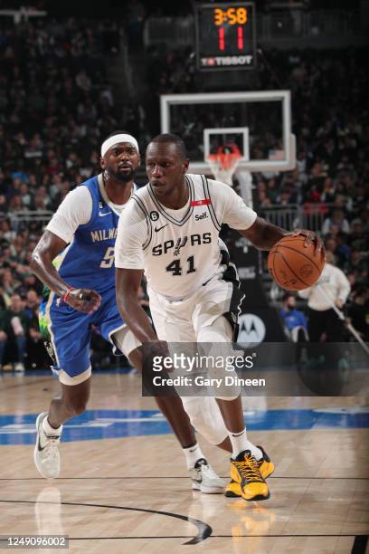 Gorgui Dieng of the San Antonio Spurs dribbles the ball during the game against the Milwaukee Bucks on March 22, 2023 at the Fiserv Forum Center in...