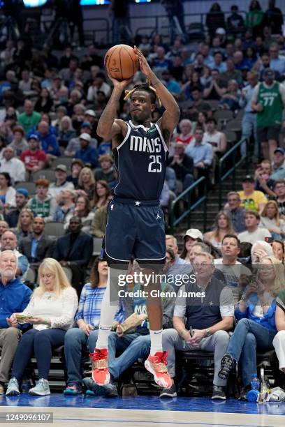 Reggie Bullock of the Dallas Mavericks shoots a three point basket during the game against the Golden State Warriors on March 22, 2023 at the...