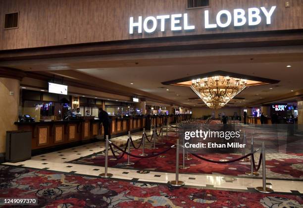The hotel lobby and check-in desk at Excalibur Hotel & Casino are nearly empty shortly before the Las Vegas Strip property opened to guests for the...