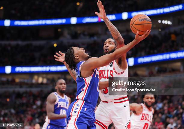 Philadelphia 76ers guard Tyrese Maxey drives to the basket past Chicago Bulls forward Derrick Jones Jr. During a NBA game between the Philadelphia...