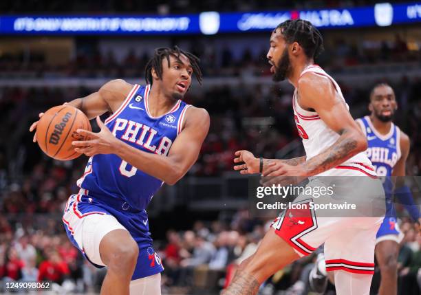 Chicago Bulls forward Derrick Jones Jr. Guards Philadelphia 76ers guard Tyrese Maxey during a NBA game between the Philadelphia 76ers and the Chicago...
