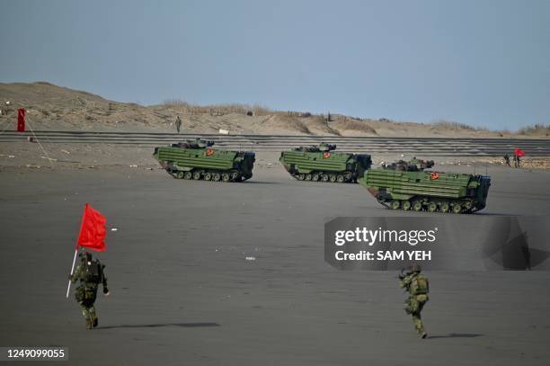 Landing vehicles drive on a beach during a military drill in Taoyuan on March 23, 2023.