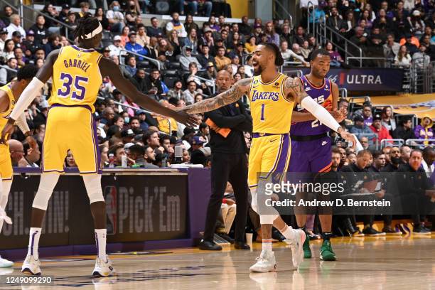 Angelo Russell of the Los Angeles Lakers high fives Wenyen Gabriel of the Los Angeles Lakers during the game against the Phoenix Suns on March 22,...