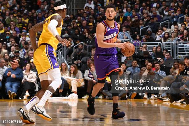 Devin Booker of the Phoenix Suns dribbles the ball during the game against the Los Angeles Lakers on March 22, 2023 at Crypto.Com Arena in Los...