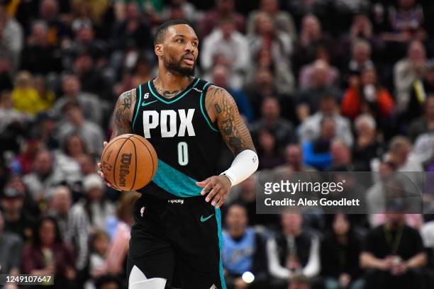 Damian Lillard of the Portland Trail Blazers brings the ball up court during the second half against the Utah Jazz at Vivint Arena on March 22, 2023...