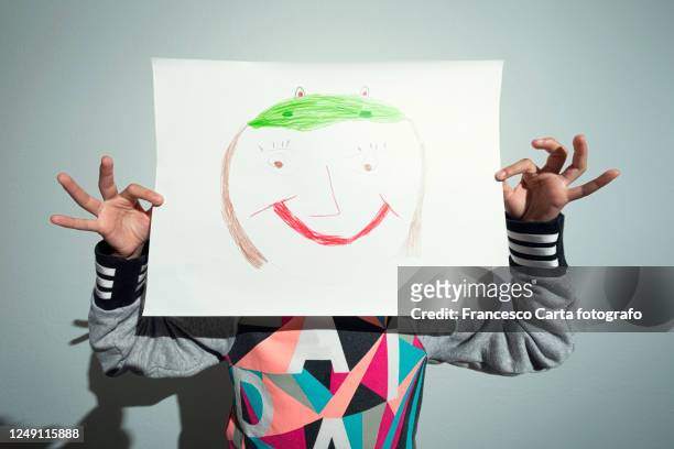 anthropomorphic smiley face - kid holding crayons stock pictures, royalty-free photos & images