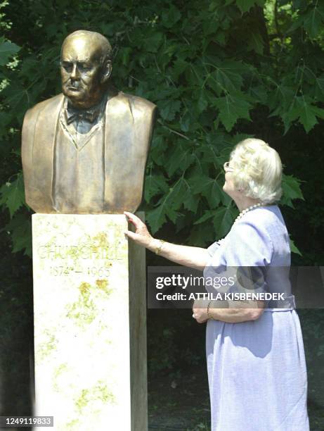 Lady Mary Soames, the daughter of British Prime Minister Winston Churchill stands beside the recently unveiled statue of her father in Varosliget...