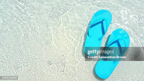 summer vacation abstract background. blue flip flops on the sandy beach - beach tropical deserted blue sky stock-fotos und bilder