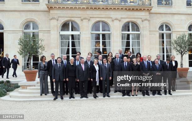 French President Nicolas Sarkozy arrives to pose with Prime Minister Francois Fillon and members of the newly reshuffled French government for a...